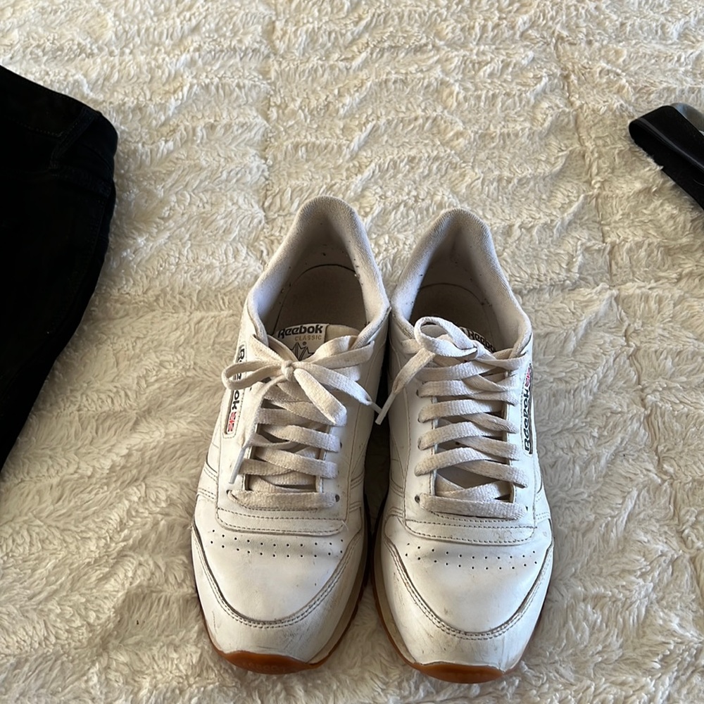 A pair of mens white Reeboks